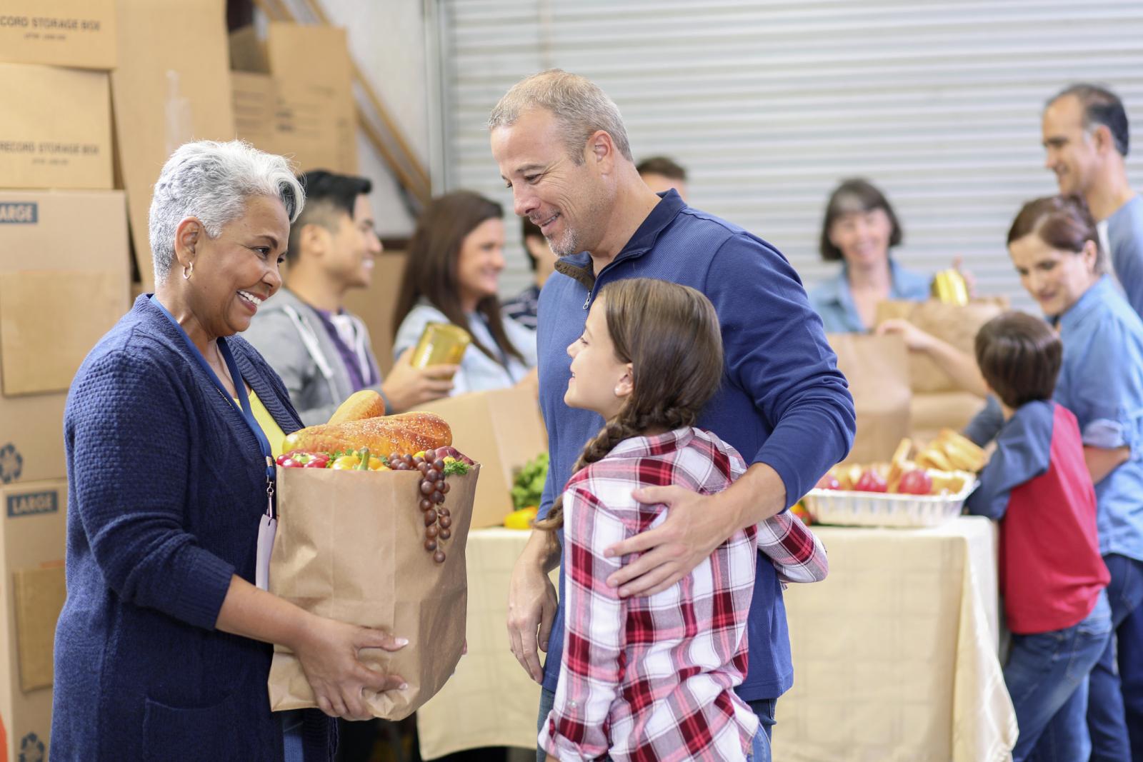 Group of volunteers work at food bank