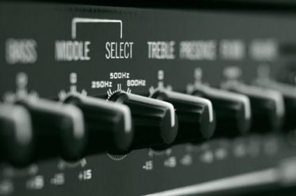 Closeup of a bass guitar amp's knobs