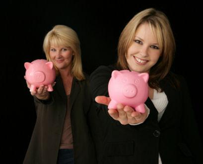 Two women with piggybanks