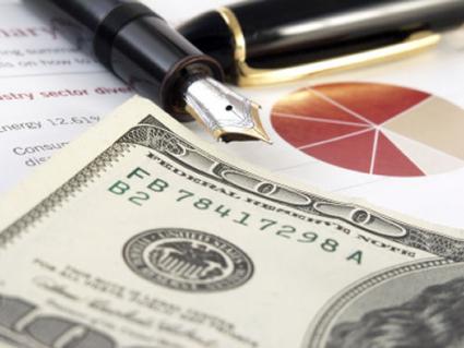 Money, pie chart, and ink pen
