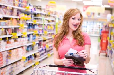 Female Walmart shopper with coupons