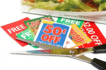 Scissors and coupons cut from ad