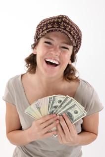Laughing cheapskate showing off her money