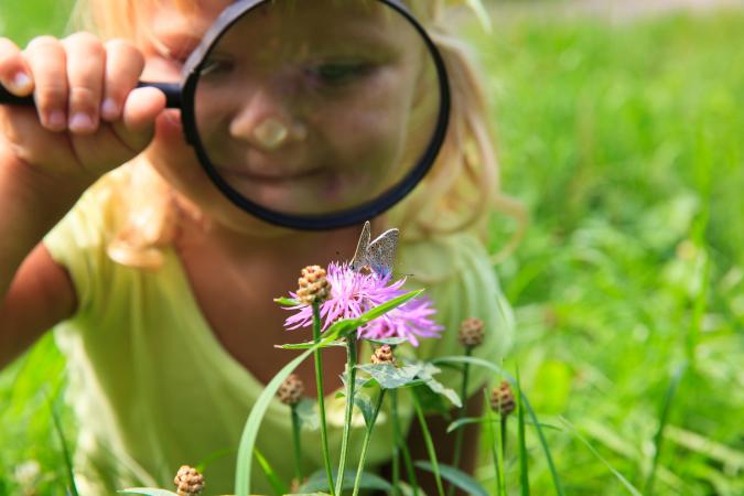 girl with magnifying glass