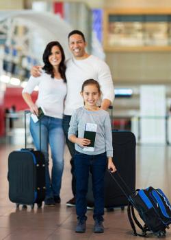 Family preparing to go on airplane trip