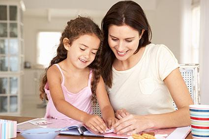 Mother and daughter scrapbooking