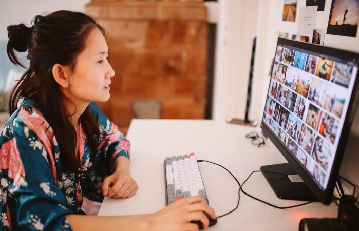 Woman on computer looking at photos