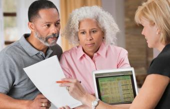 Older couple consulting with financial planner