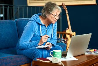 Elderly woman using laptop