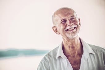 Cheerful Senior Man with white beard outdoors