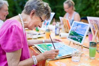 Senior woman drawing largest assisted living companies