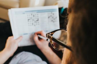 Woman doing Sudoku puzzle