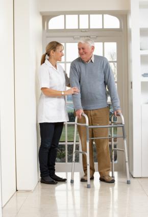 woman helping a man with a walker