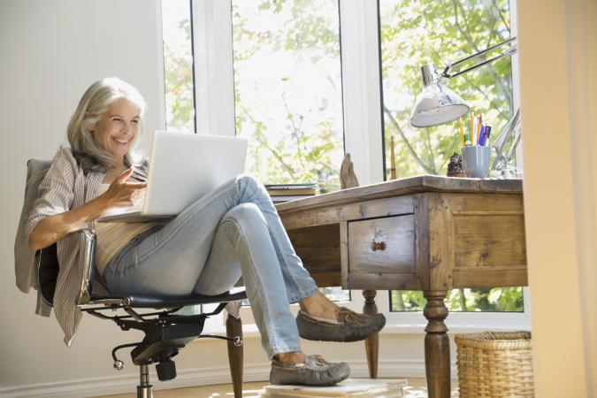 Senior woman using laptop