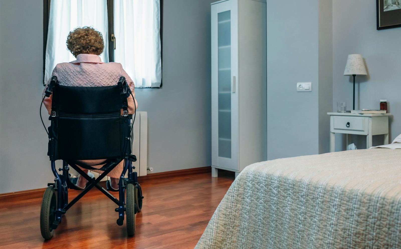 Elderly in a wheelchair feeling lonely