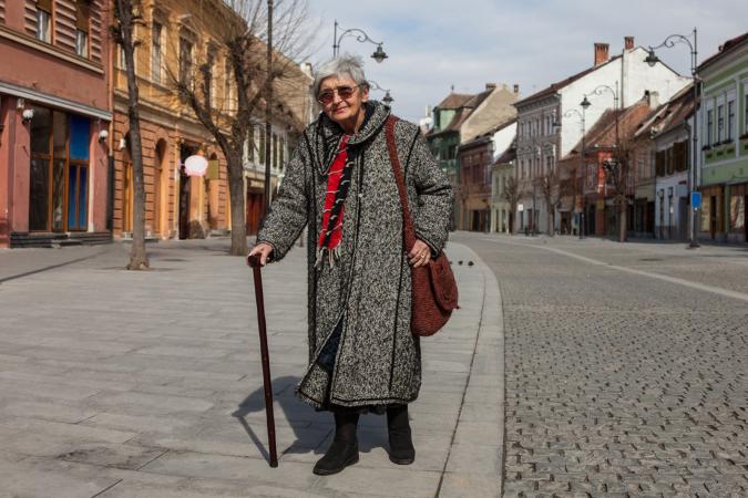 Senior woman walking with a cane