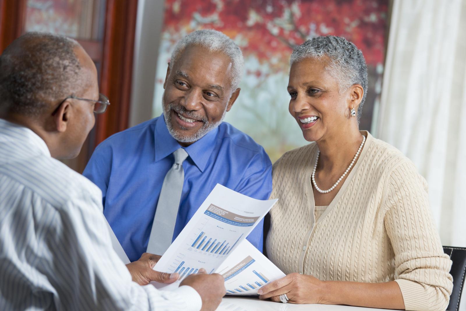 Couple talking to businessman