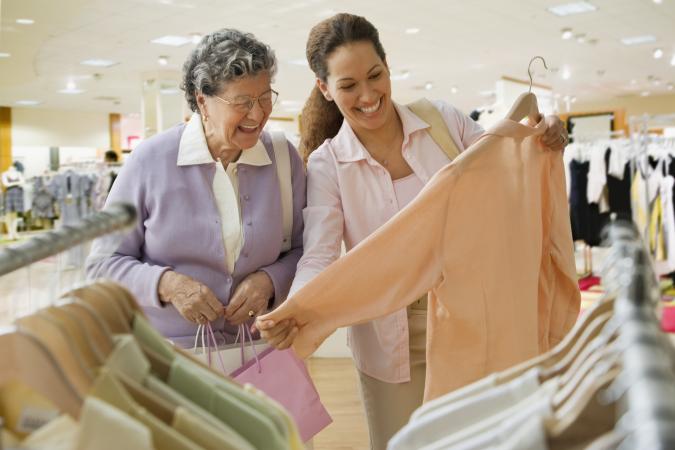 Senior woman and companion shopping for a blouse