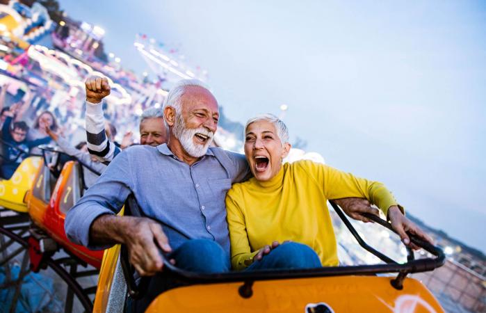 seniors having fun on rollercoaster