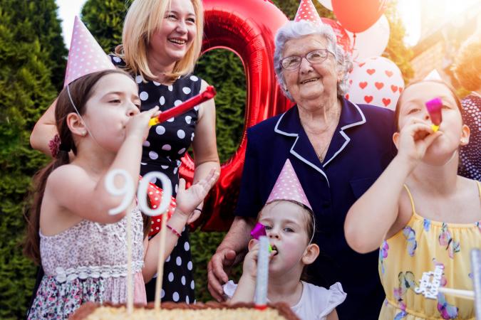 Happy kids celebrating grandmother's birthday