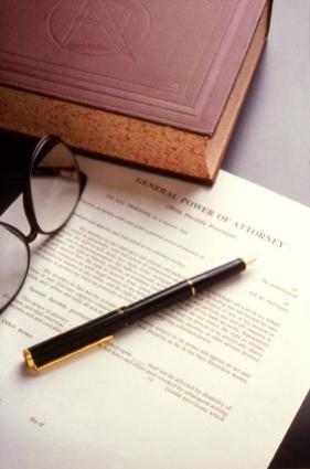 Lawbook, eyeglasses, and a Power of Attorney document