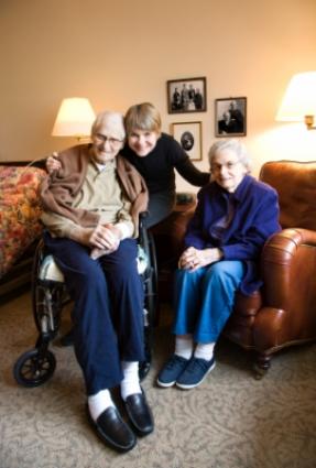 Adult daughter with her senior parents