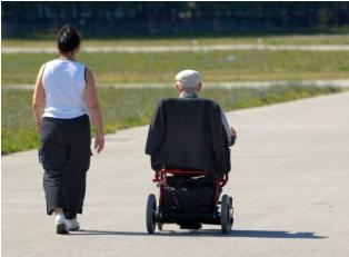 Senior citizen receiving assistance