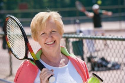 senior woman playing tennis