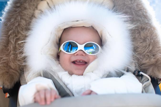 Baby in warm stroller