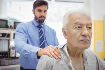 Blue-lipped man being examined by a doctor