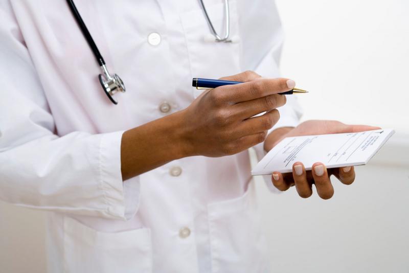 doctor writing prescription
