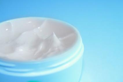 Image of an open jar of eye cream