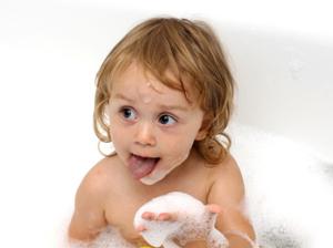 Little girl playing in her bubble bath
