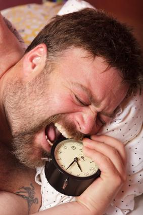 Man chewing clock