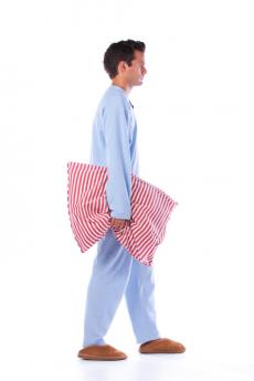 Man with pillow sleepwalking