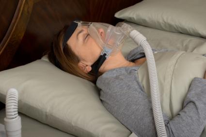 Sleeping woman wearing CPAP mask; © Brian Chase | Dreamstime.com