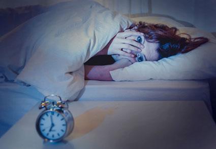 Woman in bed with insomnia