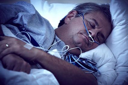 Man wearing home sleep test equipment