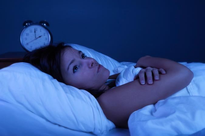 woman in bed with insomnia