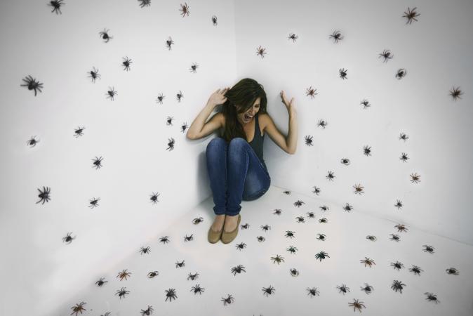 Woman having nightmare about spiders