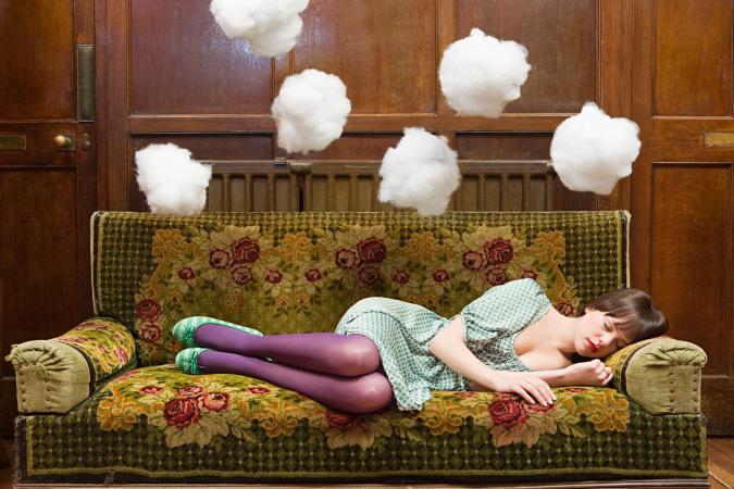 A teenage girl sleeping and dreaming