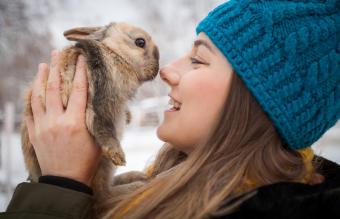 Woman holding rabbit