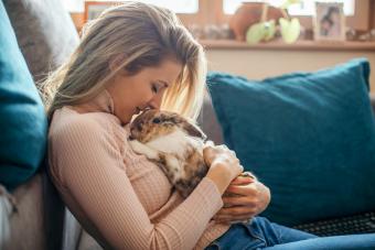 Young woman and her rabbit pet