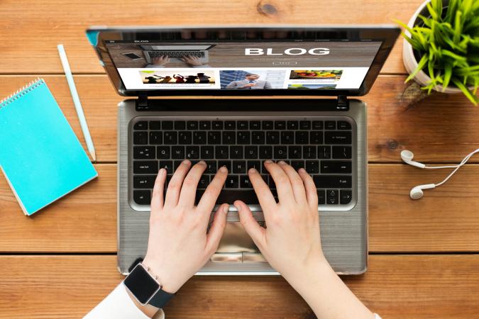 woman blogging on laptop