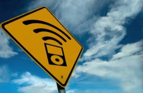 Yellow sign with a podcasting symbol