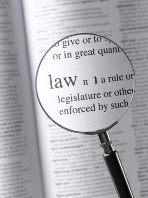 Magnifying glass over the definition of a law