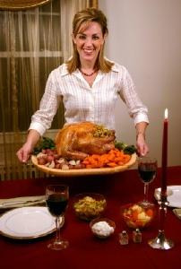 Woman serving a Thanksgiving turkey