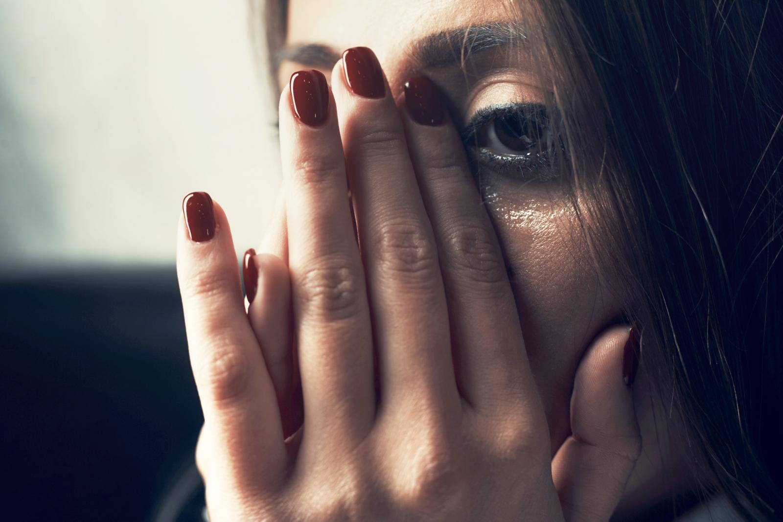 Depressed young woman crying