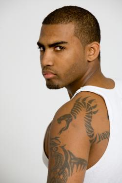 Man with tribal snake tat on arm