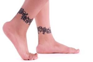 Vine tattoos on both ankles